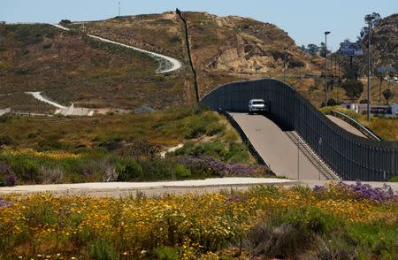 U.S. Border patrol agents man the fence with Mexico at Border Field State Park in San Diego, California, U.S., April 30, 2017. REUTERS/Mike Blake