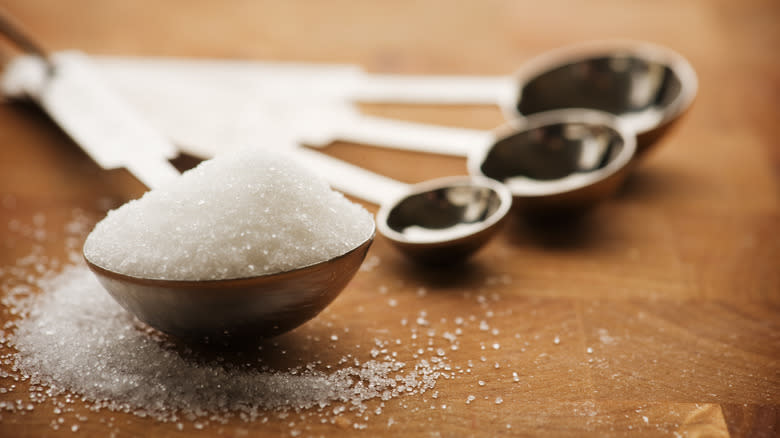 Close-up of sugar in spoons