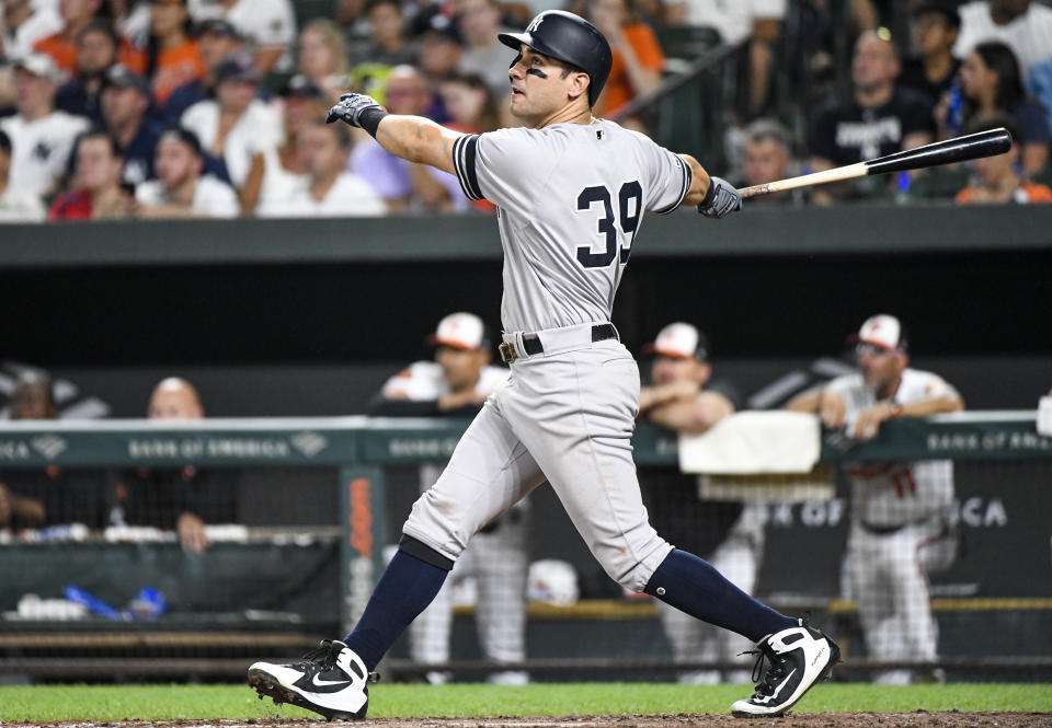 BALTIMORE, MD - AUGUST  5: New York Yankees left fielder Mike Tauchman (39) hits a sixth inning solo home run during the game between the New York Yankees and the Baltimore Orioles on August 5, 2019, at Orioles Park at Camden Yards in Baltimore, MD.  (Photo by Mark Goldman/Icon Sportswire via Getty Images)