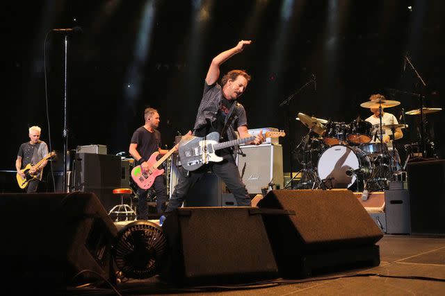 <p>Kevin Mazur/Getty</p> Pearl Jam performs onstage at Madison Square Garden in New York City in September 2022