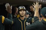 Sep 18, 2017; Detroit, MI, USA; Oakland Athletics first baseman Matt Olson (28) is congratulated by teammates after he hits a two run home run in the third inning against the Detroit Tigers at Comerica Park. Mandatory Credit: Rick Osentoski-USA TODAY Sports