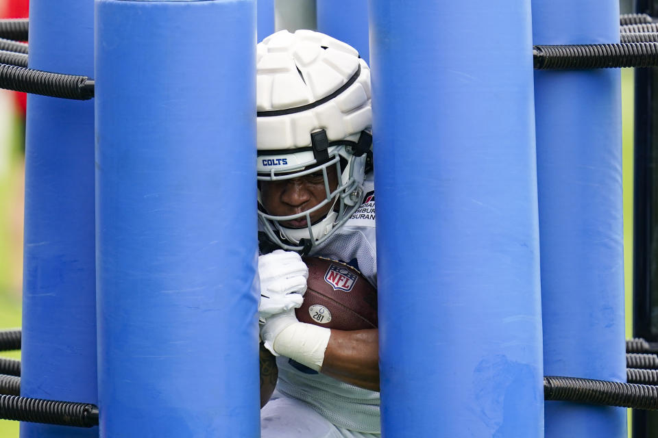 Indianapolis Colts running back CJ Verdell (42) runs a drill during practice at the NFL team's football training camp in Westfield, Ind., Tuesday, Aug. 2, 2022. (AP Photo/Michael Conroy)