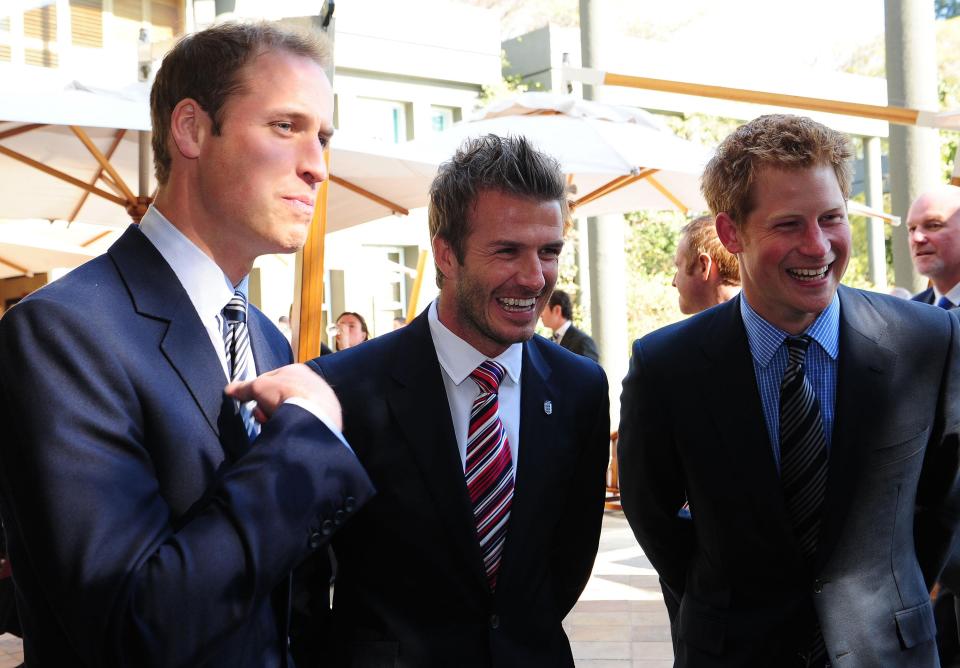 Prince William (left) and Prince Harry flank David Beckham at a reception in Johannesburg on June 19, 2010, in honor of the 2010 Football FIFA World Cup. (Owen Humphreys - PA Images via Getty Images)