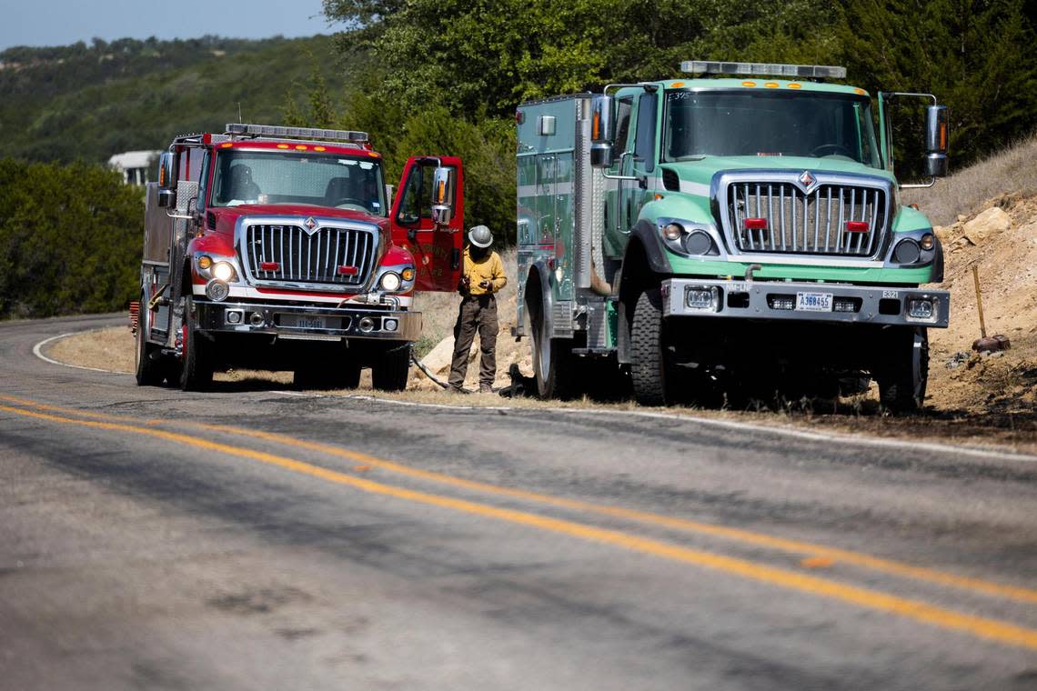 Fire crews fight a wildfire along FM 1148 on Tuesday, July 19, 2022, near Possum Kingdom Lake in Graham. The fire had consumed 500 acres and was 10 percent contained.