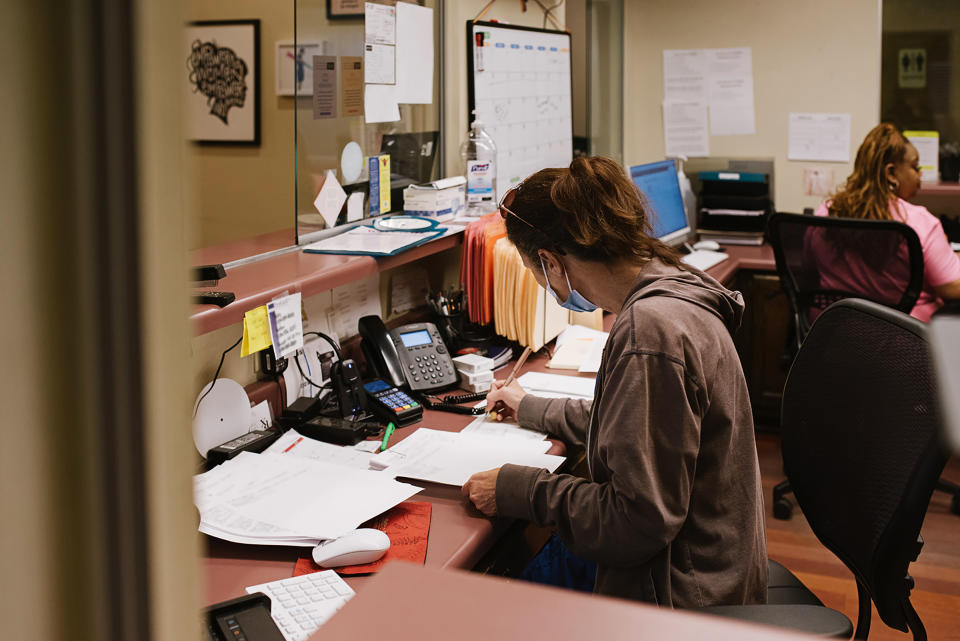 Office manager Tina Collins, left, and administrative assistant Gail Latham at the clinic on July 11. A small portion of the photograph has been obscured to protect personal privacy.<span class="copyright">Lucy Garrett for TIME</span>