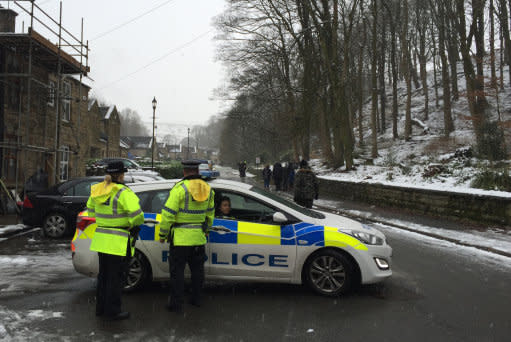 A general view of police near the scene after mother-of-three Sadie Hartley, 60, was murdered in a &quot;ferocious&quot; knife attack at her &pound;450,000 home in the village of Helmshore, Lancashire.