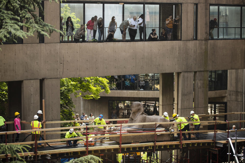 Workers move a 25,000-pound Sphinx of Ramses II at the Penn Museum in Philadelphia, Wednesday, June 12, 2019. The 3,000-year-old sphinx is being relocated from the Egypt Gallery where it's resided since 1926 to a featured location in the museum's new entrance hall. (AP Photo/Matt Rourke)