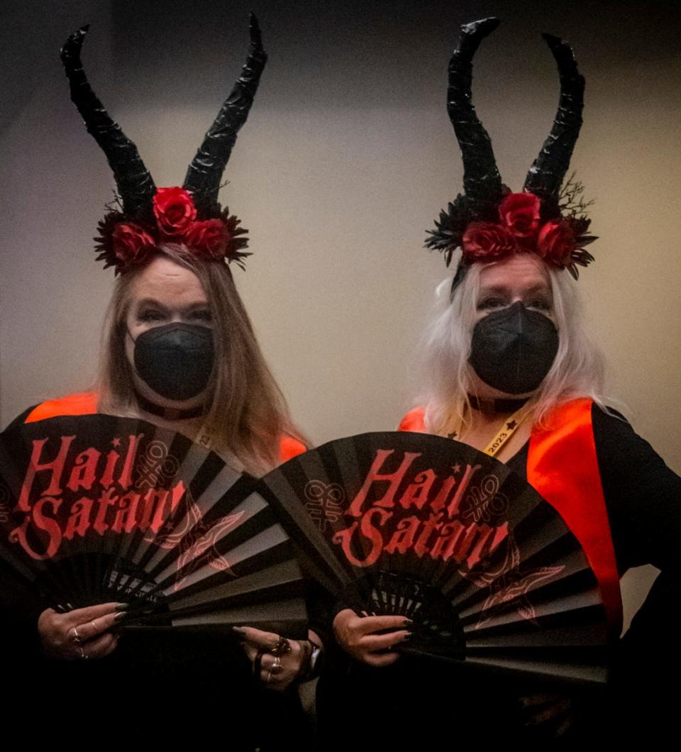 Sherri Dean, left, and Annabel Lee Morgan of The Satanic Temple Missouri chapter attend SatanCon in Boston, Mass., on April 28, 2023.