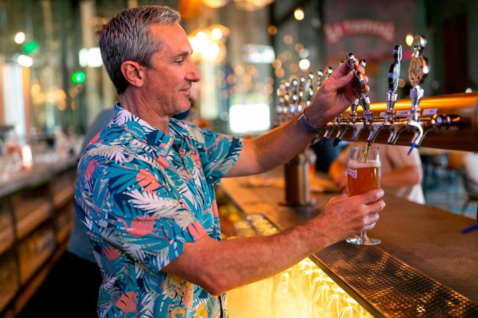 Manny Portuondo, the CEO of Cerveceria La Tropical, pours La Tropical’s La Original Amber Lager at his brewery and taproom in Wynwood, Florida on Wednesday, Feb. 17, 2021.