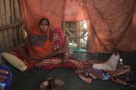 Eysa Mohammed sits in her house after sustaining injuries from an explosive that was left near her house in Kasagita town