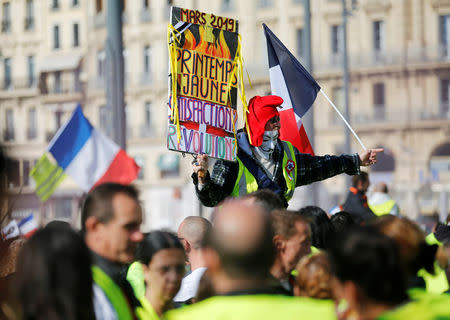 Protesters wearing yellow vests take part in a demonstration of the "yellow vests" movement in Marseille, France, February 23, 2019. REUTERS/Jean-Paul Pelissier