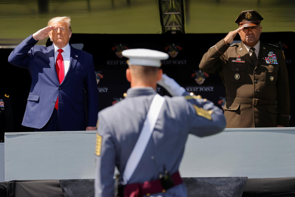 U.S. President Donald Trump salutes alongside U.S. Army Lieutenant General Darryl Williams, the Superintendent of the U.S. Military Academy at West Point, as he prepares to deliver the commencement address at the 2020 United States Military Academy Graduation Ceremony in West Point, New York, U.S., June 13, 2020.  REUTERS/Mike Segar