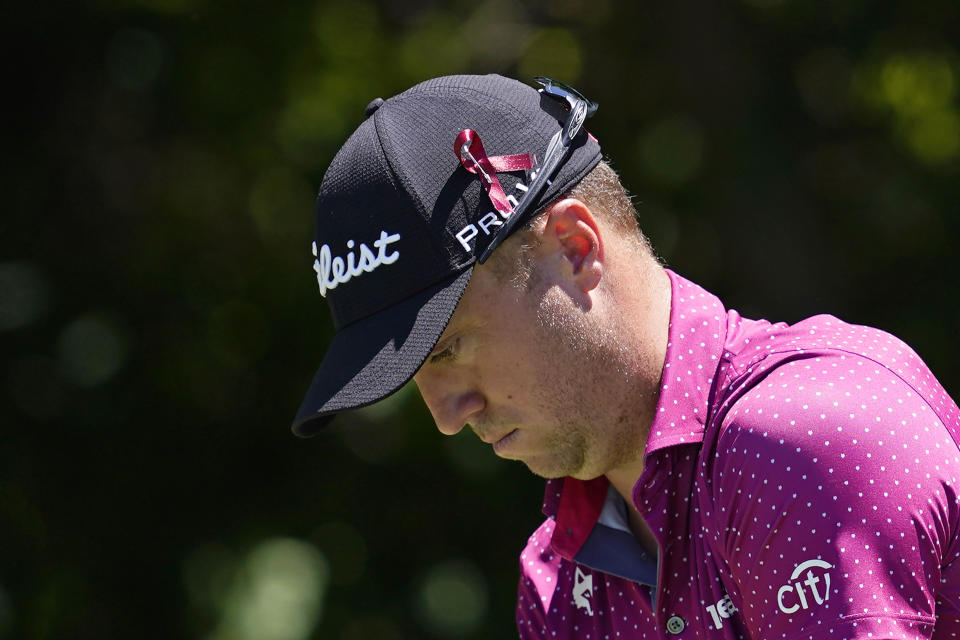 Justin Thomas gets ready to hit off the sixth tee during the first round of the Charles Schwab Challenge golf tournament at the Colonial Country Club, Thursday, May 26, 2022, in Fort Worth, Texas. Many players wore ribbons pinned to their caps to show support for the community of Uvalde, Texas _ about 350 miles south of the course _ after 19 students and two teachers were killed in a shooting at an elementary school on Tuesday. (AP Photo/Tony Gutierrez)