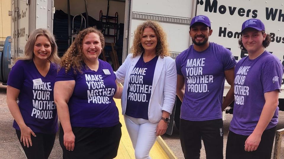 Angela Drake, center, is the owner of Two Men and  Truck in Sioux Falls. The company is hosting its annual Movers for Moms clothing drive that benefits EmBe's Dress for Success program.