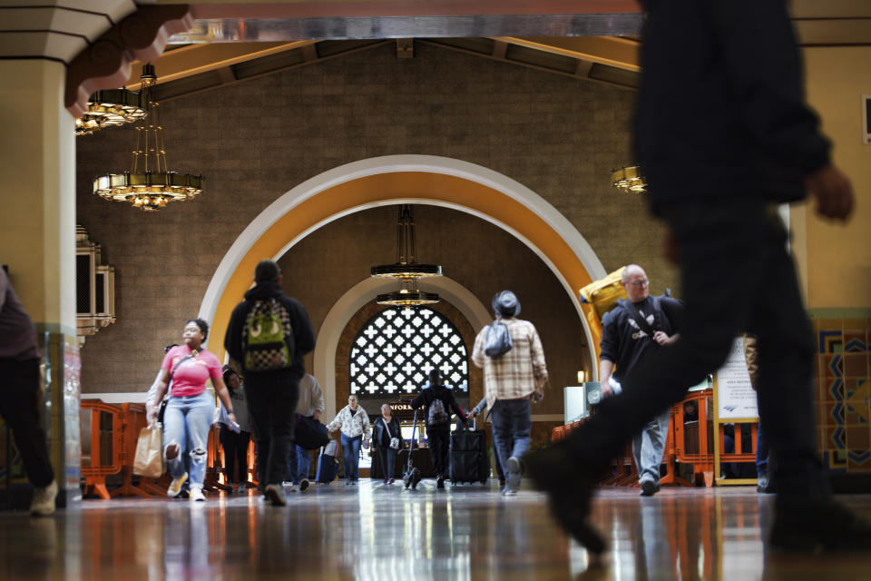 Passengers arrive at Union Station in downtown Los Angeles on Monday, Nov. 13, 2023. Los Angeles drivers are being tested in their first commute since a weekend fire that closed a major elevated interstate near downtown. Commuters were urged to work from home or take public transportation into downtown Los Angeles. (AP Photo/Richard Vogel)