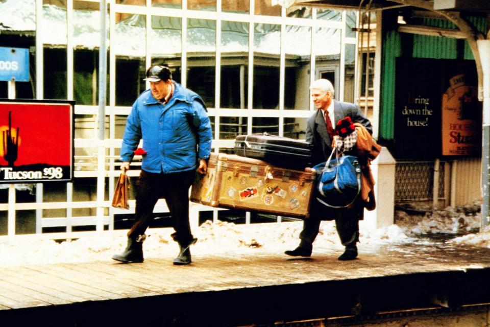 PLANES, TRAINS AND AUTOMOBILES, from left: John Candy, Steve Martin, 1987, © Paramount/courtesy Ever