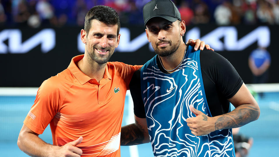 Novak Djokovic and Nick Kyrgios pose for a photo and give a thumbs up after their exhibition match prior to the Australian Open.