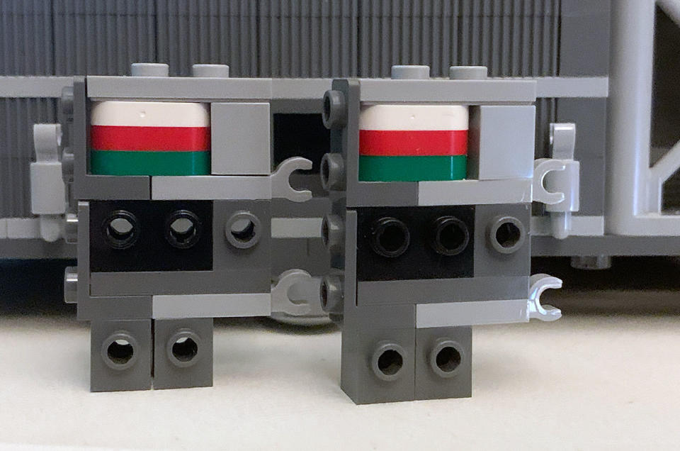 The white, red and green plates hidden in the tail pylons of the Lego Icons NASA Artemis Space Launch System are a 