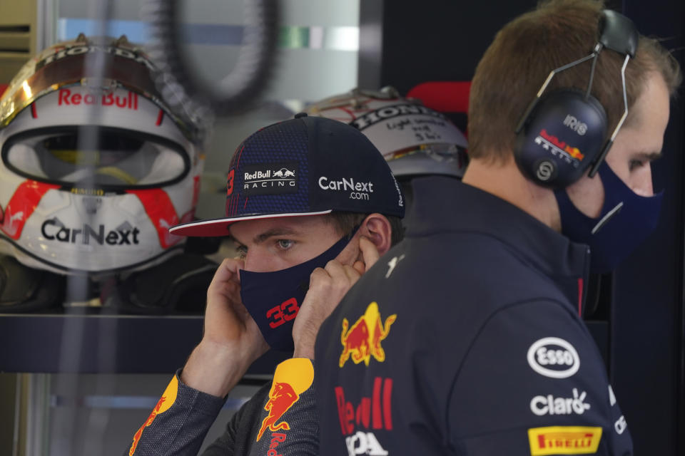 Red Bull driver Max Verstappen, of The Netherlands, covers his ears in the pits prior a practice run of the Formula One Mexico Grand Prix auto race at the Hermanos Rodriguez racetrack in Mexico City, Saturday, Nov. 6, 2021. (AP Photo/Fernando Llano)