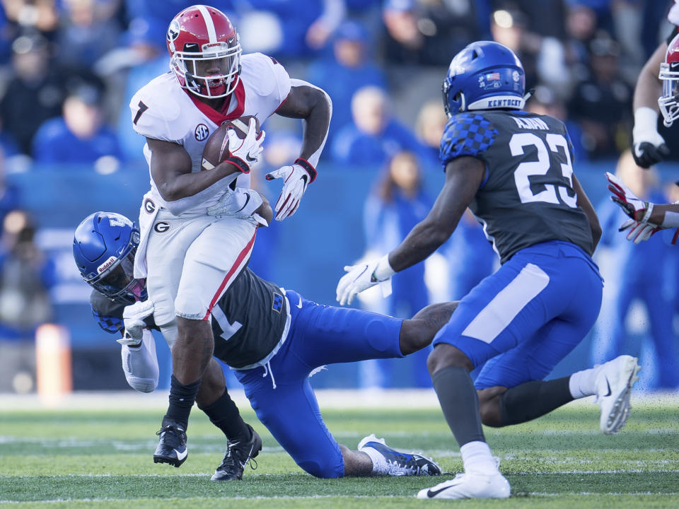 Georgia running back D'Andre Swift (7) runs with the ball during the first half an NCAA college football game against Kentucky in Lexington, Ky., Saturday, Nov. 3, 2018. (AP Photo/Bryan Woolston)