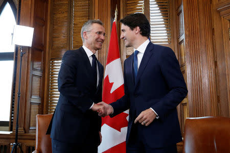 Canada's Prime Minister Justin Trudeau shakes hands with NATO Secretary General Jens Stoltenberg during a meeting in Trudeau's office on Parliament Hill in Ottawa, Ontario, Canada, April 4, 2018. REUTERS/Chris Wattie