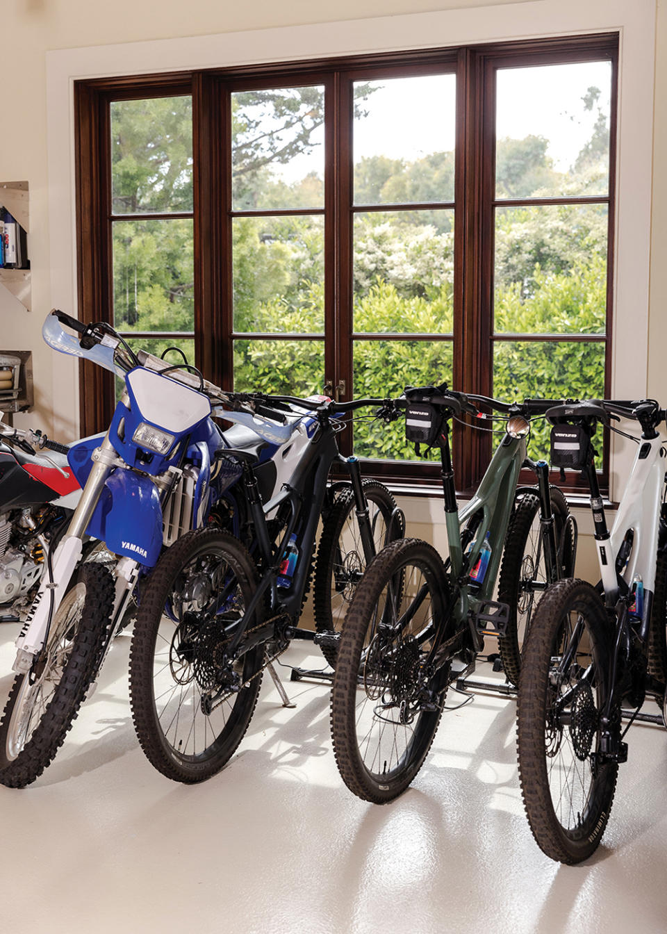 His bike collection includes models from Yamaha, Honda, and Specialized