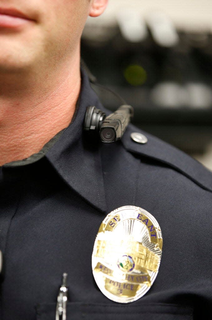 An officer in West Valley City, Utah, wears a new body camera in March.