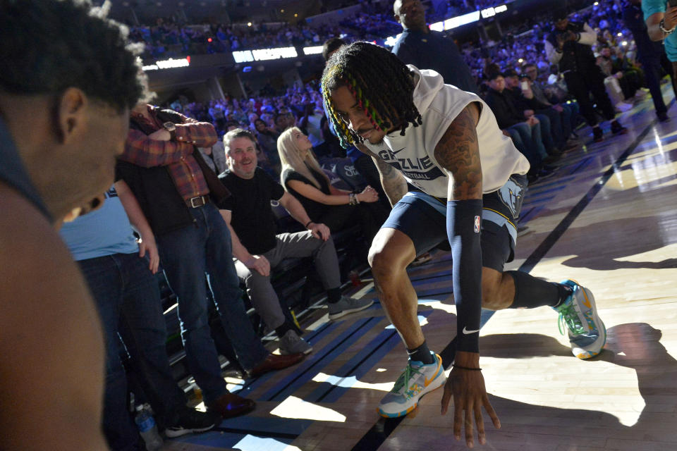 Memphis Grizzlies guard Ja Morant and forward Jaren Jackson Jr., left, warm up before and an NBA basketball game against the Houston Rockets Wednesday, March 22, 2023, in Memphis, Tenn. (AP Photo/Brandon Dill)