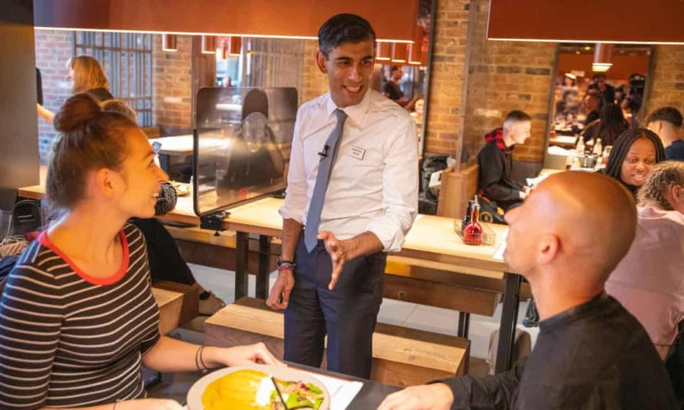 Rishi Sunak staged a photocall at a Wagamama restaurant where he was seen serving customers but not wearing a face mask (Simon Walker/HM Treasury)