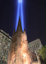 <p>The Tribute in Light rises above the Trinity Church on Broadway, Sept. 11, 2017. (Gordon Donovan/Yahoo News) </p>