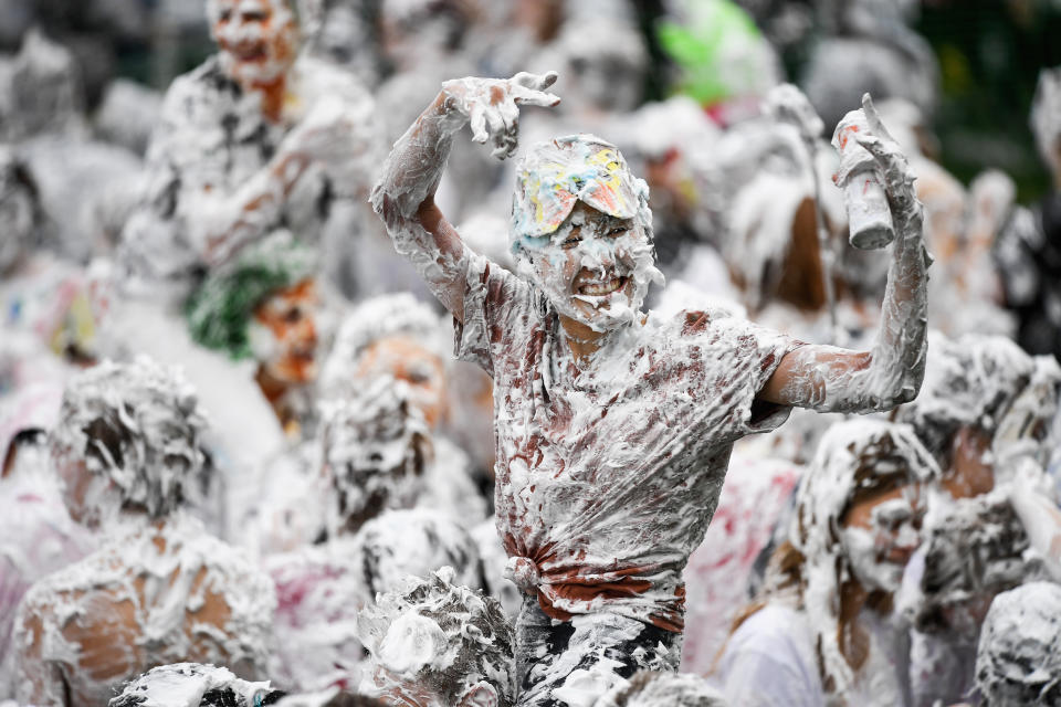 <p>Students from St Andrews University indulge in a tradition of covering themselves with foam to honor the “academic family” on Lower College Lawn on Oct. 23, 2017, in St Andrews, Scotland. (Photo: Jeff J Mitchell/Getty Images) </p>