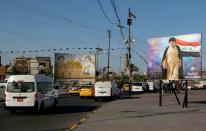 Posters are seen of Iraqi Shi'ite cleric Moqtada al-Sadr and his father, the late Grand Ayatollah Mohammed Sadiq al-Sadr, and Iraq's late Shi'ite cleric Mohammed Baqir al-Sadr, in the Sadr City district of Baghdad