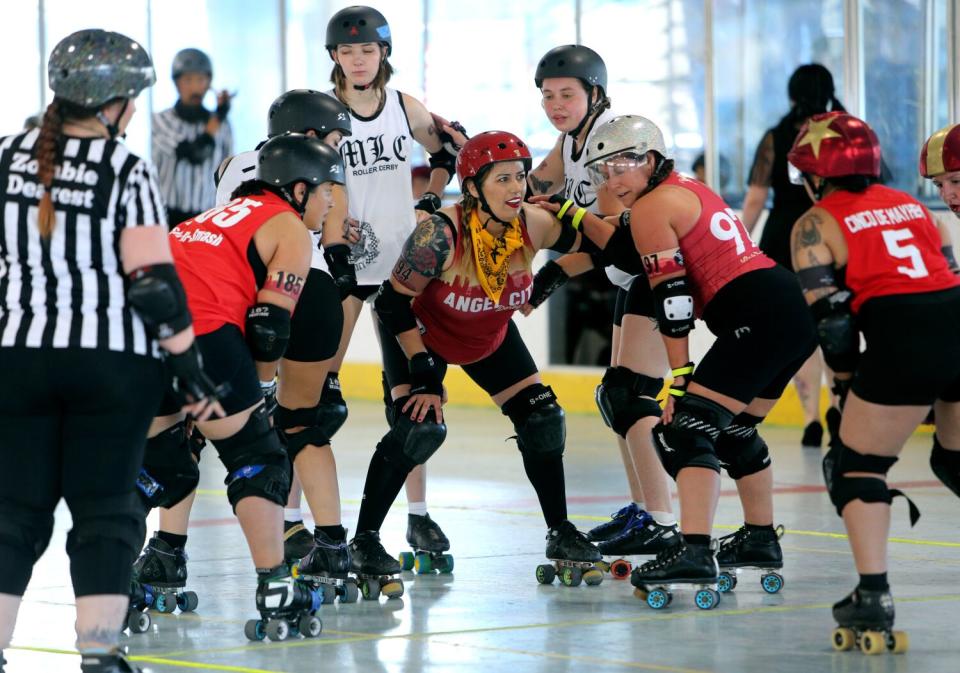 Nohemy Martinez, center, prepares to jam against the Misery Loves Company team.