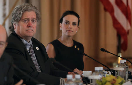 White House Chief Strategist Steve Bannon (L) listens with U.S. Deputy National Security Advisor for Strategy Dina Powell (R) during a bilateral meeting between U.S. President Donald Trump (L) and China's President Xi Jinping (Not Pictured) at Trump's Mar-a-Lago estate in Palm Beach, Florida, April 7, 2017. REUTERS/Carlos Barria