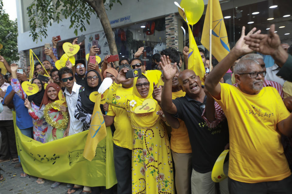Supporters of Maldives’ former president Mohamed Nasheed, cheers upon his arrival in Maldives, Thursday, Nov.1, 2018. Nasheed, the first democratically elected president of the Maldives returned home Thursday after more than two years in exile to escape a long prison term. (AP Photo/Mohamed Sharuhaan)