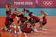 Players from the United States react after defeating Brazil to win the gold medal in women's volleyball at the 2020 Summer Olympics, Sunday, Aug. 8, 2021, in Tokyo, Japan. (AP Photo/Frank Augstein)