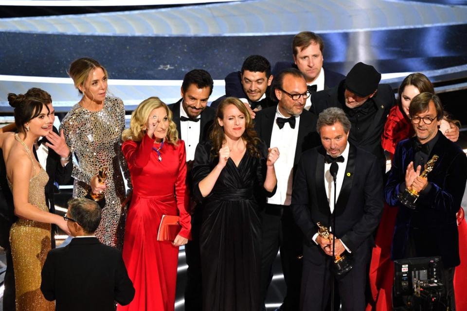 Coda cast and crew accept the award for Best Picture onstage during the 94th Oscars at the Dolby Theatre in Los Angeles (AFP via Getty)
