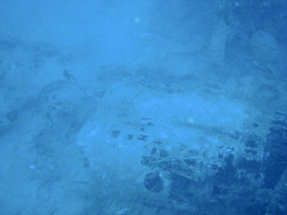 In this undated photo provided by the Australian Defence Force, the wreckage of a World War II bomber lays on the seabed of Gasmata Harbour in West New Britain Province, Papua New Guinea. Officials have confirmed the identities of an Australian bomber and the remains of two air crew members more than 80 years after they crashed in flames off the coast of Papua New Guinea, Australian Air Force said in a statement on Wednesday, April 10, 2024. (Australian Defence Force via AP)