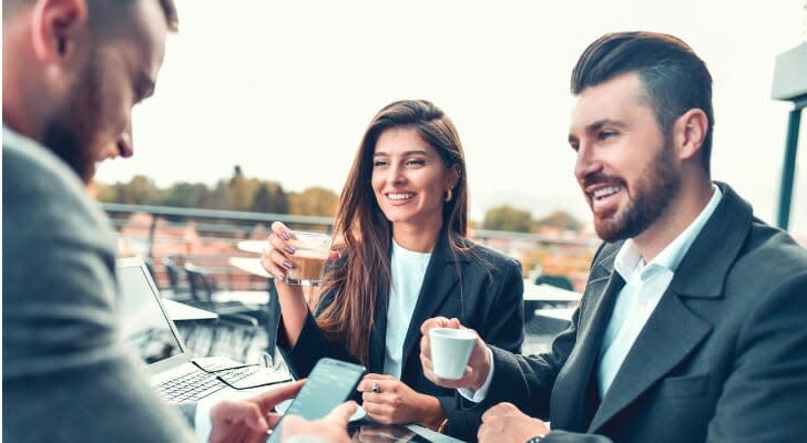 Young couple discusses insurance with a broker