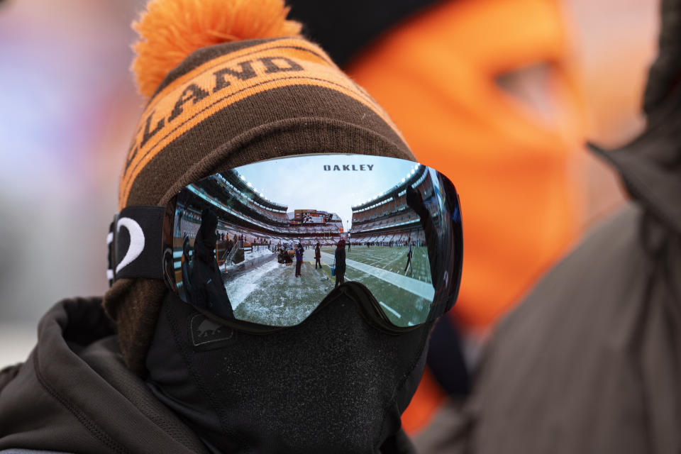 Dec 24, 2022; Cleveland, Ohio, USA; FirstEnergy Stadium is reflected in the snow goggles of a Cleveland Browns fan who is bundled up for the freezing temperature before the game against the New Orleans Saints. Mandatory Credit: Scott Galvin-USA TODAY Sports