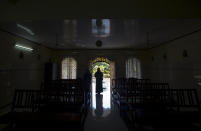 In this Sunday, Nov. 4, 2018, photo, a nun walks out of chapel of St. Francis Mission Home after offering prayers, in Kuravilangad in the southern Indian state of Kerala. For decades, nuns in India have quietly endured sexual pressure from Catholic priests, an AP investigation has revealed. (AP Photo/Manish Swarup)