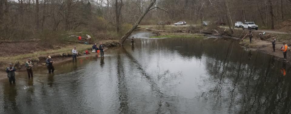 Trout fishermen line the banks of the Flat Brook in Walpack, Sussex County in this file photo taken the first day of the 2021 trout season. This year's trout season opens at 8 a.m. Saturday.