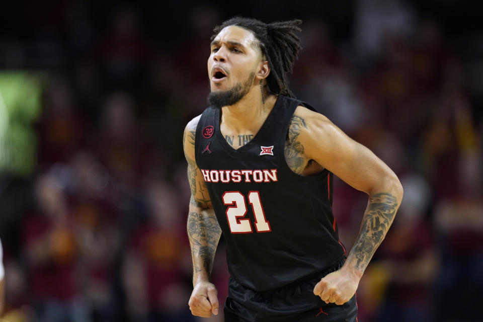 Houston guard Emanuel Sharp (21) reacts after making a basket during the second half of an NCAA college basketball game against Iowa State, Tuesday, Jan. 9, 2024, in Ames, Iowa. (AP Photo/Charlie Neibergall)