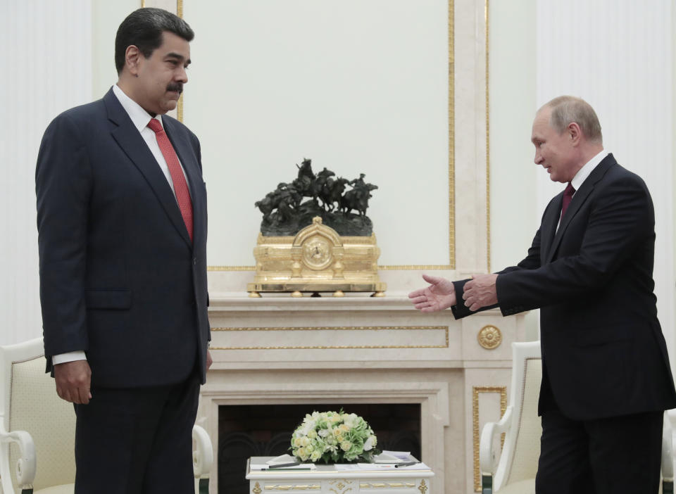 Russian President Vladimir Putin, right, welcomes Venezuela's President Nicolas Maduro during their meeting in the Kremlin in Moscow, Russia, Wednesday Sept. 25, 2019. Nicolas Maduro is on a working visit to Moscow. (Sergei Chirikov/Pool Photo via AP)