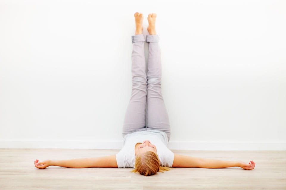This simple pose, performed against a wall, is excellent for evening relaxation and stress relief. Bielkus recommends staying in the pose for as long as five minutes, with the eyes closed and using a soothing eye pillow if desired.  <br><br> "When we flip the legs up, the blood can rush back down to the heart," says Bielkus. "It has a soothing quality."