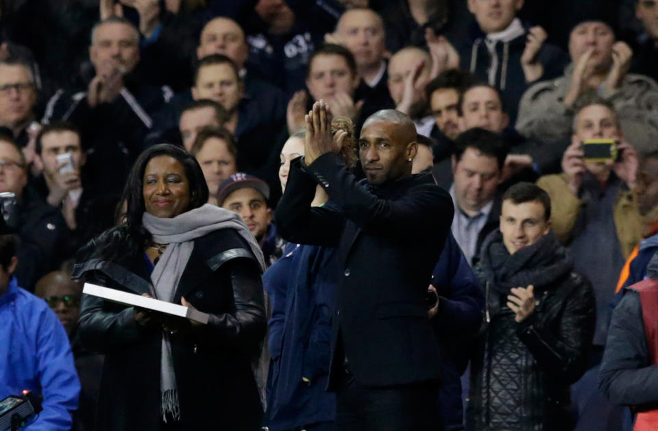 Jermain Defoe applauds the fans in the interval at half-time as he is presented before them to say goodbye after signing from Tottenham to join FC Toronto, during the Europa League Group K soccer match between Tottenham Hotspur and Dnipro at White Hart Lane stadium in London, Thursday, Feb. 27, 2014. (AP Photo/Matt Dunham)