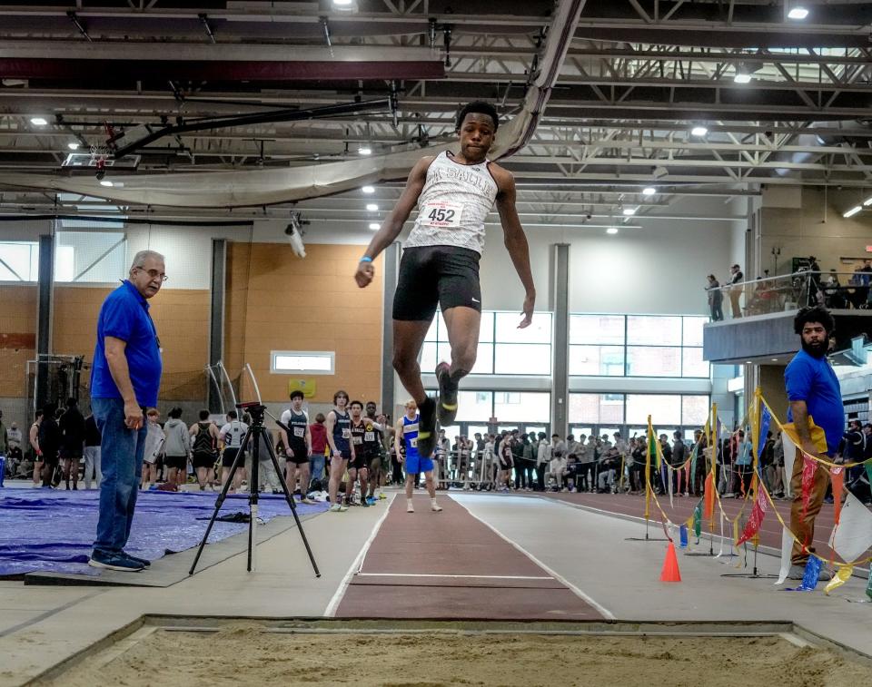 La Salle's Ephraim Abhulime wins the long jump with a leap of 22 feet, 6.5 inches on Saturday.
