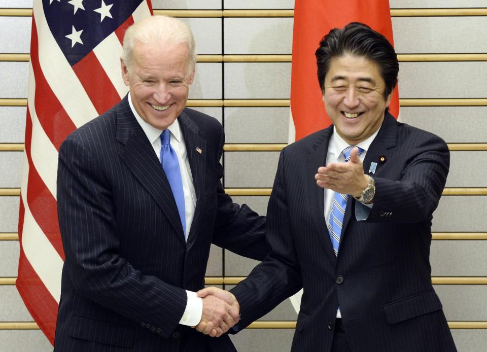 U.S. Vice President Joe Biden is welcomed by Japanese Prime Minister Shinzo Abe before their talks at Abe's official residence in Tokyo