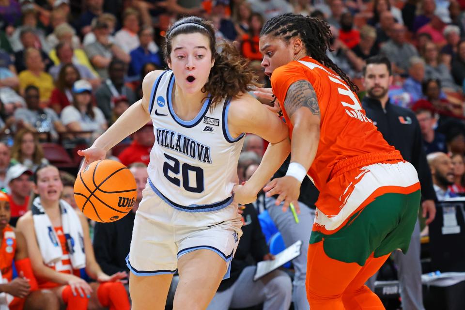 GREENVILLE, SOUTH CAROLINA - MARCH 24: Maddy Siegrist #20 of the Villanova Wildcats drives to the basket against Destiny Harden #3 of the Miami Hurricanes during the first half in the Sweet 16 round of the NCAA Women's Basketball Tournament at Bon Secours Wellness Arena on March 24, 2023 in Greenville, South Carolina. (Photo by Kevin C. Cox/Getty Images)