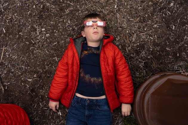 Augustus Krach, 6, looks to the sky wearing glasses before the Solar Eclipse on Monday in Niagara Falls, New York. 